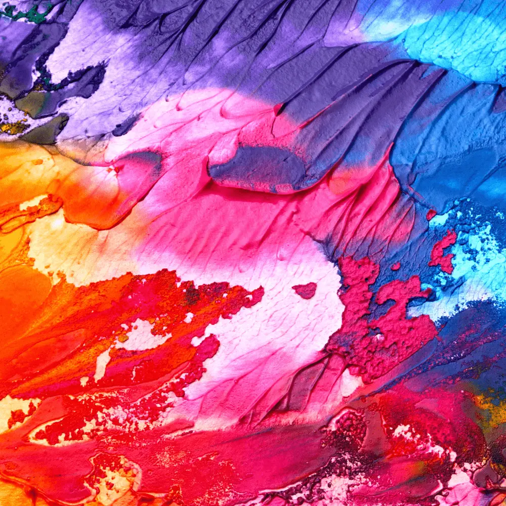 Abstract close-up of vibrant paint textures in shades of pink, purple, and blue, symbolizing the therapeutic use of art in the program.